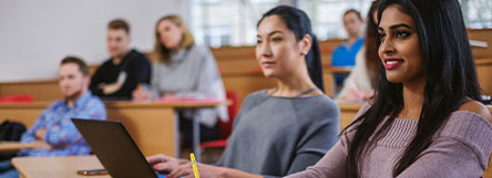 Female Students Listening to Lecture